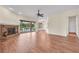Bright living room features wood floors, a fireplace, and views to the exterior at 10510 Lithia Estates Dr, Lithia, FL 33547