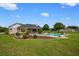 A beautifully maintained pool is surrounded by a deck and landscaping, perfect for outdoor relaxation at 10510 Lithia Estates Dr, Lithia, FL 33547