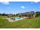 Inviting pool with lush landscaping, set against the backdrop of a lovely home at 10510 Lithia Estates Dr, Lithia, FL 33547