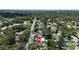 This aerial shot captures a home nestled in a tree-lined neighborhood with well-maintained streets at 1116 W Kirby St, Tampa, FL 33604
