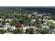 Aerial view of a cozy home situated amongst a lush, green neighborhood with mature trees at 1116 W Kirby St, Tampa, FL 33604