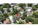 An aerial view shows a home in a residential neighborhood with mature trees at 1116 W Kirby St, Tampa, FL 33604