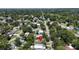 An aerial view of a home and neighborhood with mature trees and landscaping at 1116 W Kirby St, Tampa, FL 33604