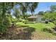 Expansive backyard with ample green space and a lattice covered area for outdoor enjoyment at 1116 W Kirby St, Tampa, FL 33604