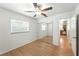 Bedroom with wood-look flooring and a mirrored sliding door closet at 1116 W Kirby St, Tampa, FL 33604