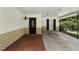 Covered carport with brick accents, offering convenient parking and shelter from the elements at 1116 W Kirby St, Tampa, FL 33604
