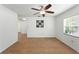 Spacious dining area featuring stylish wood-look flooring and a modern ceiling fan at 1116 W Kirby St, Tampa, FL 33604