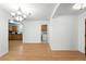 The dining room has hardwood flooring and leads into the kitchen with a washing machine at 1116 W Kirby St, Tampa, FL 33604