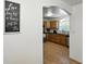 Traditional kitchen with wooden cabinets and modern stainless steel appliances seen through an arched doorway at 1116 W Kirby St, Tampa, FL 33604