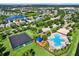 Stunning aerial view of the community showcasing homes, lush green spaces, and lakes at 11309 Langworth Hill Ln, Riverview, FL 33579