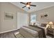 Bedroom featuring hardwood floors, ceiling fan, and a double door closet at 11309 Langworth Hill Ln, Riverview, FL 33579