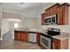 Well-equipped kitchen with granite countertops, stainless steel appliances, and ample cabinet space for storage at 11309 Langworth Hill Ln, Riverview, FL 33579