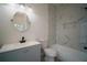 Stylish bathroom featuring a modern vanity, decorative tile accents, and a built-in niche for toiletries at 11403 Wellman Dr, Riverview, FL 33578