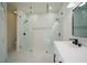 Bright bathroom with a large, glass shower enclosure, modern fixtures, and a white vanity at 11403 Wellman Dr, Riverview, FL 33578