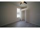 Well lit room features a standard closet, wood-look floors, and a window at 11403 Wellman Dr, Riverview, FL 33578