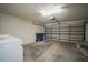 Spacious garage with a modern overhead door and plenty of room for parking and storage at 11403 Wellman Dr, Riverview, FL 33578