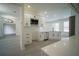 Stylish kitchen featuring white cabinetry, stainless steel appliances, modern fixtures, and an open layout at 11403 Wellman Dr, Riverview, FL 33578