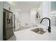Modern kitchen features stainless steel appliances, white cabinets, sleek hardware, and a bright, airy atmosphere at 11403 Wellman Dr, Riverview, FL 33578