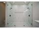 Modern bathroom boasting a large, glass enclosed shower with dual showerheads and a built-in niche at 11403 Wellman Dr, Riverview, FL 33578