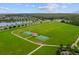 Aerial view of community park including basketball courts, and playground at 11714 Tetrafin Dr, Riverview, FL 33579