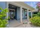Charming front porch with decorative pillars and lush landscaping at 11714 Tetrafin Dr, Riverview, FL 33579