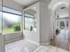 Bathroom with glass shower and a view of the pool area at 12439 Bristol Commons Cir, Tampa, FL 33626