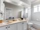 Bathroom features double vanity, marble countertops, and modern fixtures at 12439 Bristol Commons Cir, Tampa, FL 33626