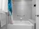 Bathroom showing shower and tiled wall at 12439 Bristol Commons Cir, Tampa, FL 33626