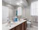 Bright bathroom featuring a double sink vanity and neutral color palette at 12439 Bristol Commons Cir, Tampa, FL 33626