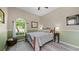 Bedroom featuring a window and hardwood floors at 12439 Bristol Commons Cir, Tampa, FL 33626