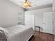 Bedroom featuring a ceiling fan, closet, and window at 12439 Bristol Commons Cir, Tampa, FL 33626