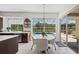 Bright dining area with sliding glass doors overlooking the pool and backyard at 12439 Bristol Commons Cir, Tampa, FL 33626