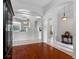Bright foyer features hardwood floors, arched entryways, and views into other rooms at 12439 Bristol Commons Cir, Tampa, FL 33626