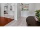 Bright foyer features tile floors, arched entryways, and views into other rooms at 12439 Bristol Commons Cir, Tampa, FL 33626