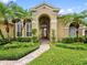 Close up of a home featuring mature landscaping at 12439 Bristol Commons Cir, Tampa, FL 33626