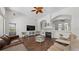 Spacious living room features a fireplace, archways and views to adjacent rooms at 12439 Bristol Commons Cir, Tampa, FL 33626