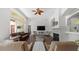 Open-concept living room features large fireplace, archways and view of the lanai at 12439 Bristol Commons Cir, Tampa, FL 33626