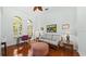 Bright living room featuring hardwood floors, decorative furnishings, and arched windows at 12439 Bristol Commons Cir, Tampa, FL 33626