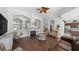 Expansive living room with archways, fireplace, and views into the kitchen and dining area at 12439 Bristol Commons Cir, Tampa, FL 33626