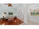 Open-concept living room with elegant arches, hardwood floors, and stylish decorations at 12439 Bristol Commons Cir, Tampa, FL 33626