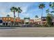 Beautiful town center entrance with palm trees and well-maintained storefronts for a welcoming ambiance at 12439 Bristol Commons Cir, Tampa, FL 33626