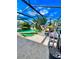 Enjoy outdoor living in this screened pool area with a lounge area and views of the surrounding landscape at 12603 Midpointe, Riverview, FL 33578