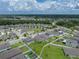 A lovely home features a fenced backyard and well-maintained lawn in a suburban neighborhood setting at 13105 Fruitville Way, Riverview, FL 33579