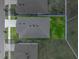 Aerial view of home showing roof, yard, and fence line at 13105 Fruitville Way, Riverview, FL 33579