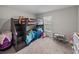 bedroom featuring a bunk bed with playful decor and a window for natural light at 13105 Fruitville Way, Riverview, FL 33579