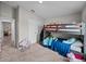 room with bunk bed, closet and access to another room in a neutral color scheme at 13105 Fruitville Way, Riverview, FL 33579