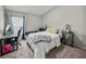 Comfortable bedroom featuring a bed, sofa, desk, and soft carpet floors at 13105 Fruitville Way, Riverview, FL 33579