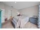 Bright bedroom featuring soft carpet floors, natural light, and closet space at 13105 Fruitville Way, Riverview, FL 33579
