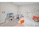 Bright bedroom features a desk, bed, decor and a tv for entertainment at 13105 Fruitville Way, Riverview, FL 33579