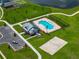 Overhead view of community pool, sand volleyball court, and resident parking area at 13105 Fruitville Way, Riverview, FL 33579